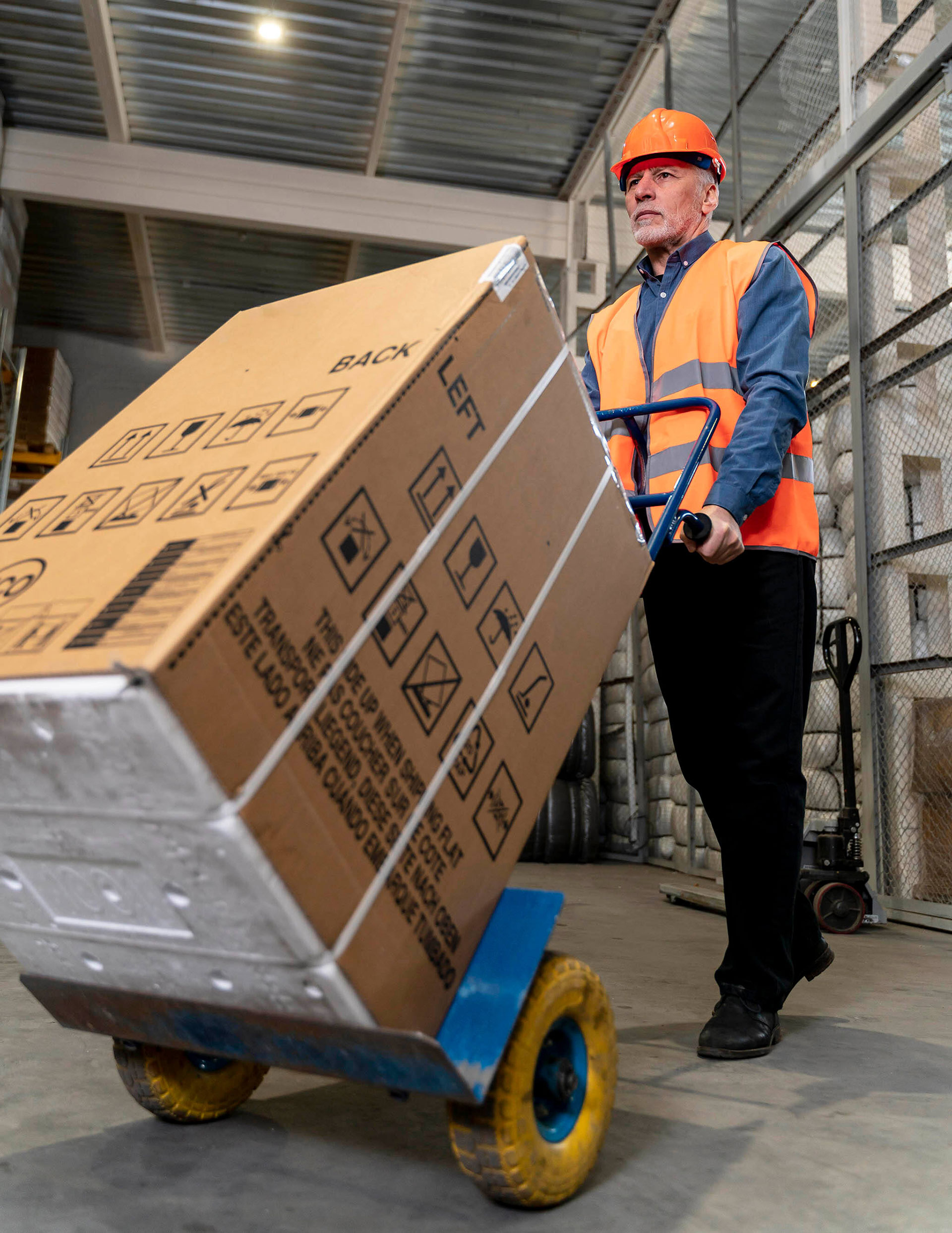 man-with-helmet-carrying-boxes-(1)